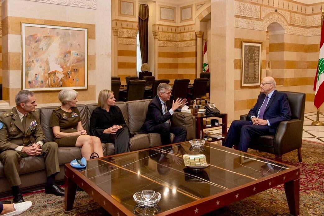 High level representatives attend a meeting.